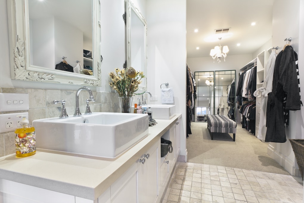 Stylish master bathroom with twin sinks and spacious walk in robe