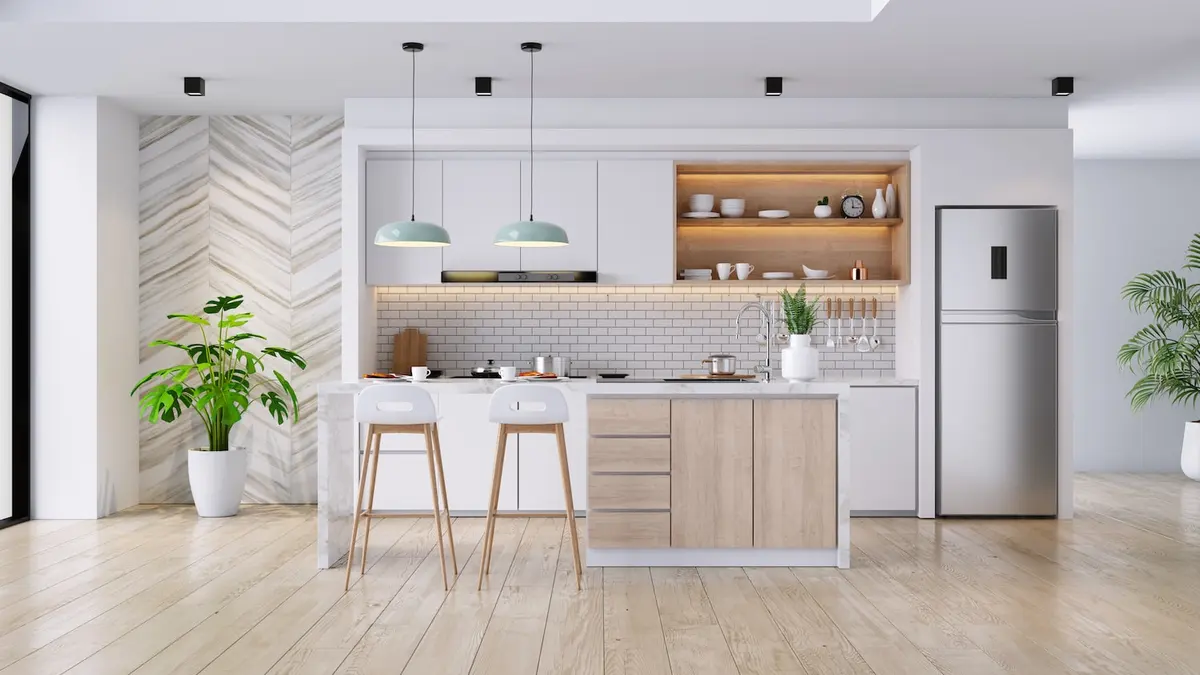 all white open concept kitchen with light wood accents 